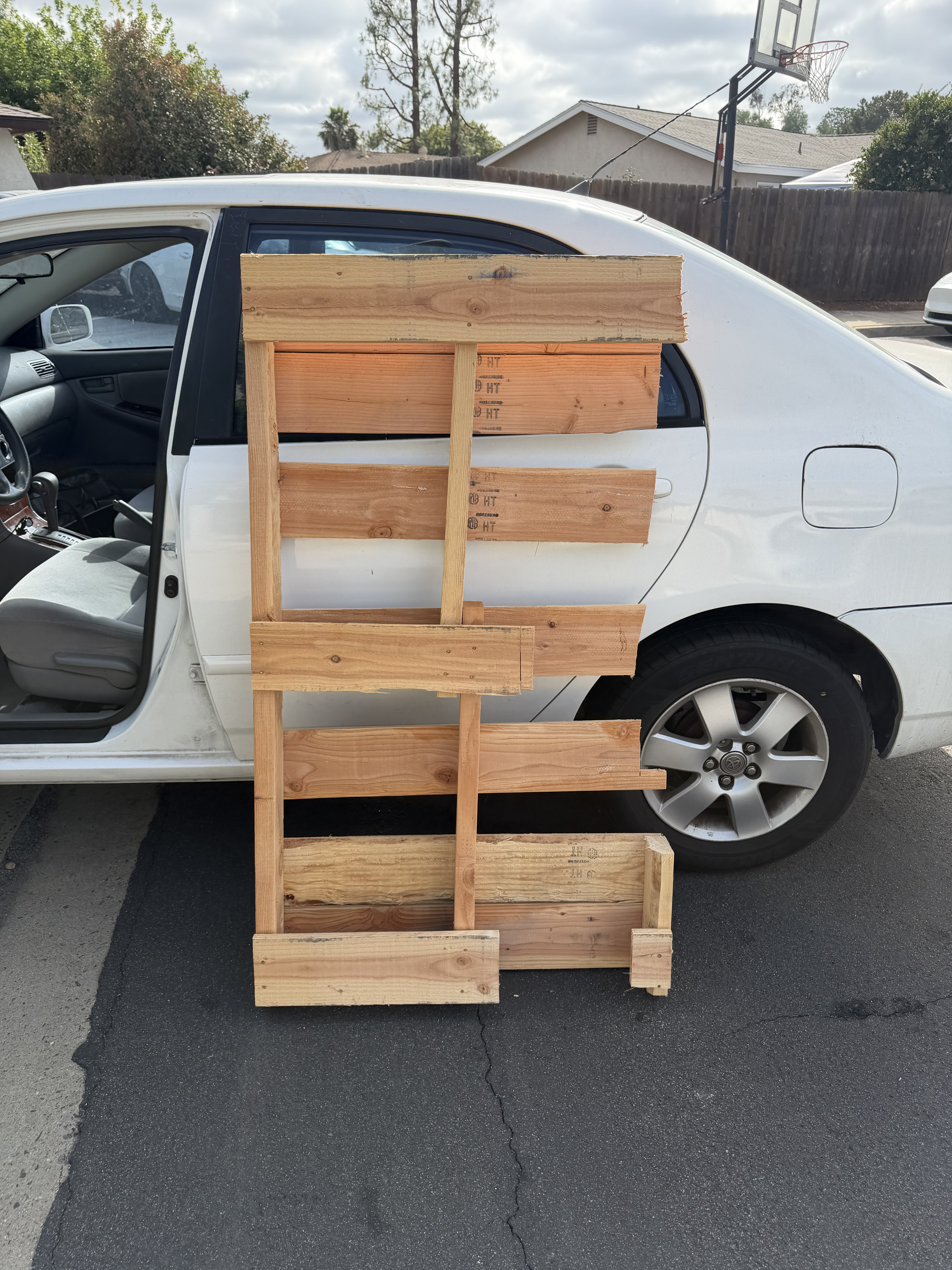 wood pallet next to car